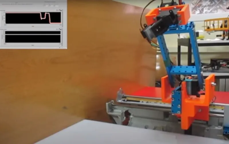 Bench-built robotic arm driven by an Arduino and a LabVIEW front panel.
